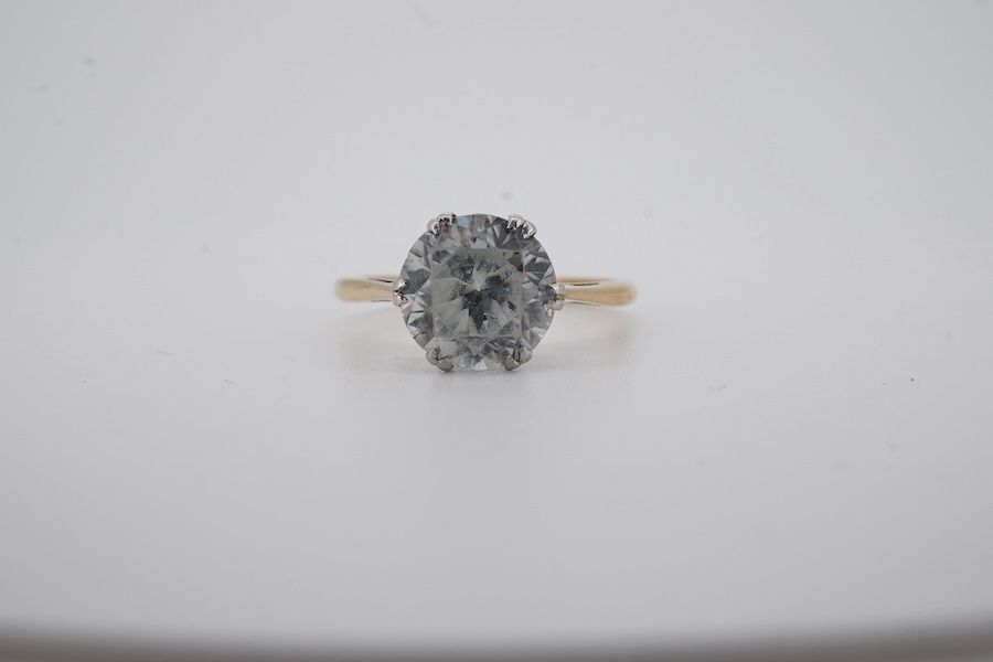 A yellow metal (stamped '9ct sil') and single stone white zircon set ring, gross weight 2.9 grams. Condition - poor to fair